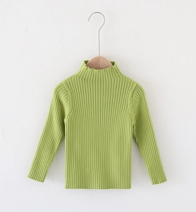 Detailed view of kids' green turtleneck ribbed knit sweater on wooden hanger