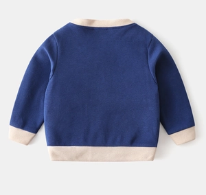 Detail view of children's navy cardigan back with beige ribbed trim and knit texture