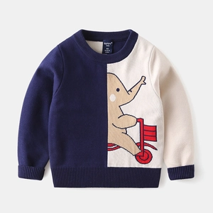 Detail of baby boy color-block sweater with embroidered elephant riding a tricycle