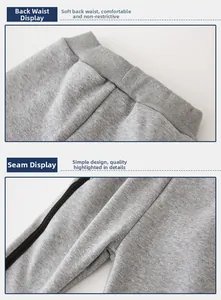 Detail of boys gray fleece joggers showing elastic ribbed waistband and side stripe stitching
