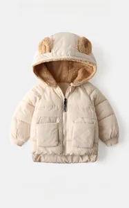 Detail of kids hooded jacket with cute bear ears and warm brown fleece lining