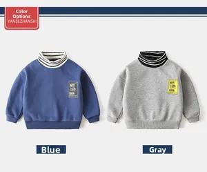Detail of blue and grey boys' thick hoodies with striped collars and square chest labels
