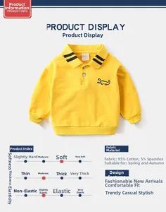 Detail of yellow cotton polo sweatshirt for boys featuring black crocodile chest embroidery
