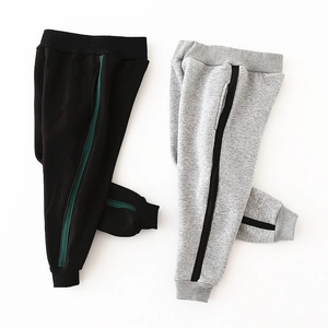 Children's fleece-lined sweatpants with contrast side stripes in grey and black