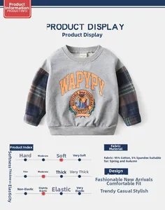 Detail view of cotton sweatshirt fabric with bear print and plaid sleeve texture
