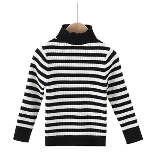Kids black and white striped turtleneck sweater with ribbed cuffs on white background