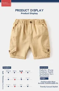 Detail of khaki cotton twill boys shorts showing elastic waistband and cargo pockets