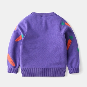 Detail of children's purple knit sweater showing orange carrot jacquard pattern on back