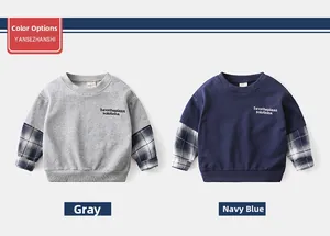 Detail of boys' layered hoodies with plaid sleeves in grey and navy blue colors