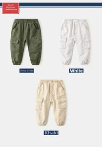 Flat lay of kids cargo pants in army green, white, and khaki with elastic cuffs