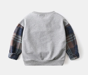 Detail of gray kids sweatshirt featuring vintage plaid sleeves and ribbed cuffs