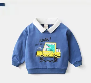 Detail of blue cotton kids sweatshirt featuring cartoon truck print and polo collar