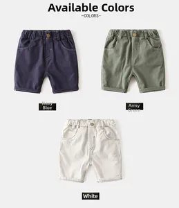 Detailed flat lay of children's cotton shorts in navy, army green, and white colors