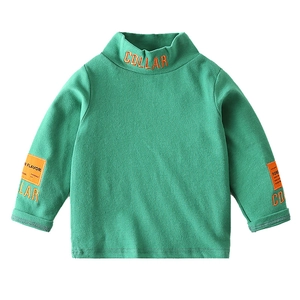 Green high-neck kids t-shirt with orange collar embroidery and sleeve patch detail