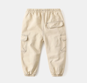 Detail of kids cargo pants with contrast stitching, elastic waist and large side pockets