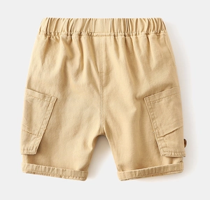 Detail of boys' khaki cargo shorts featuring elastic waist and large side pockets