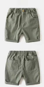 Front and back view of boys olive green cotton shorts with elastic waist and metal button
