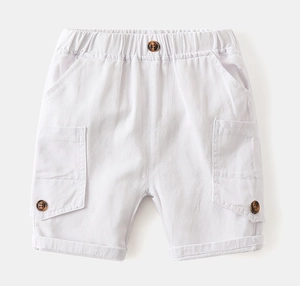 Detail of white cargo shorts for boys featuring elastic waist and large side flap pockets