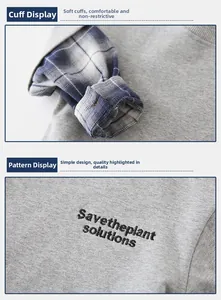 Detail of boys' grey sweatshirt showing blue checkered layered cuffs and embroidery