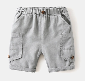 Detail view of boys grey cargo shorts featuring elastic waistband and flap pockets