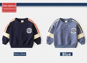 Detail of kids round neck sweatshirt showing cotton fabric and striped sleeve accents
