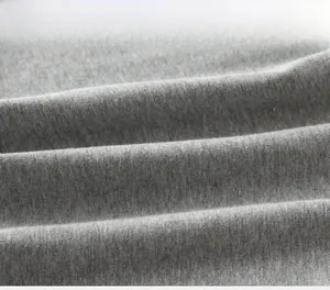 Macro shot of breathable light gray knitted cotton fabric texture for boys polo shirt