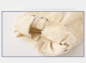 Macro view of inner stitching and durable fabric construction on toddler cargo pants
