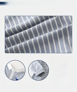 Detail of blue and white striped kids polo shirt showing embroidery and soft knit texture