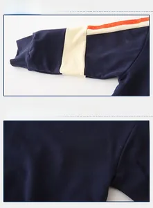 Detail of navy blue kids sweatshirt with ribbed cuffs and printed love graphics