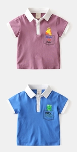 Detail of kids polo shirts in purple and blue with cartoon giraffe and frog embroidery