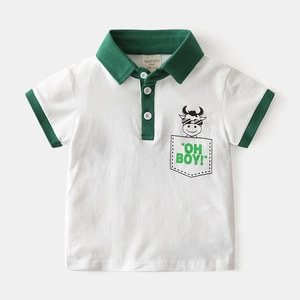 Detail of baby boy cotton polo shirt collar and logo print in white and green color