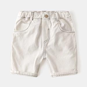 White cotton boys shorts with elastic waist, brass button and contrast stitching detail