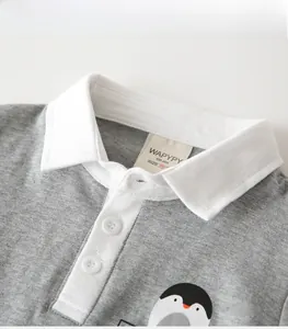 Macro detail of kids cotton polo shirt neckline with grey fabric and white collar trim