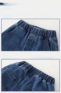 Close-up of boys' dark blue denim jeans featuring a flexible elastic waistband and pockets