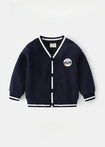 Close-up of navy knit cardigan with V-neck, striped cuffs, and cartoon car embroidery