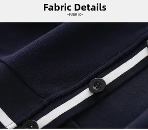 Close-up of navy knit cardigan fabric with white stripes and detailed black button