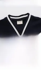 Detail of navy blue knit cardigan with car embroidery and striped V-neck collar