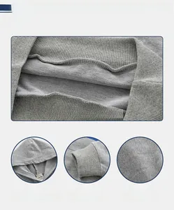 Detail of grey hooded sweatshirt showing ribbed cuffs and soft knitted fabric texture