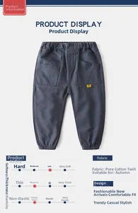 Detail of dark blue kids cotton twill pants with elastic waist and ribbed ankle cuffs