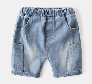 Detail of light blue denim shorts for boys with elastic waist and cargo pockets