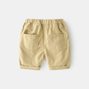 Rear view of khaki cotton boys shorts featuring elastic waist and dual back patch pockets