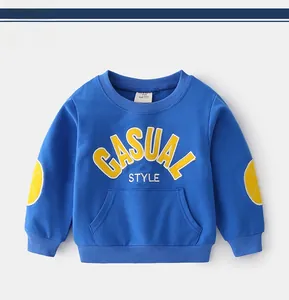Detail of kids navy sweatshirt featuring yellow elbow patches and casual embroidery