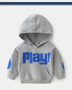 Detail of children's grey hoodie featuring blue Play! applique and kangaroo pocket