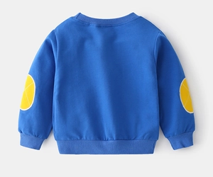 Detail view of children's blue sweatshirt with yellow elbow patches and ribbed cuffs