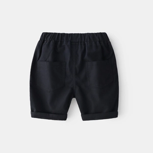 Detail of boys' black casual shorts featuring elastic waistband and rear patch pockets