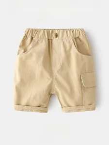 Detailed view of elastic waist and functional cargo pocket on khaki boys' cotton shorts