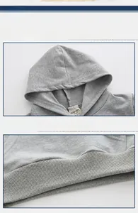Detail of gray kids hoodie showing the ribbed hem and branded neckline with size tag