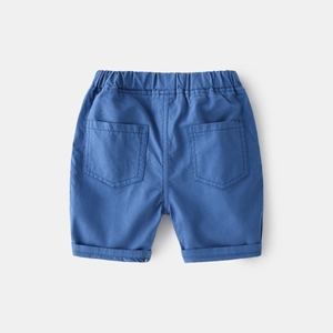 Detail view of boys' casual cotton shorts in lake blue with elastic waist and pockets