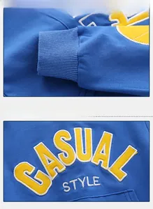 Detail of ribbed cuffs and casual style embroidery on blue children's sweatshirt