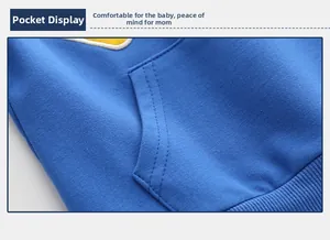 Detail of blue toddler sweatshirt featuring a kangaroo pocket and ribbed cotton hemline